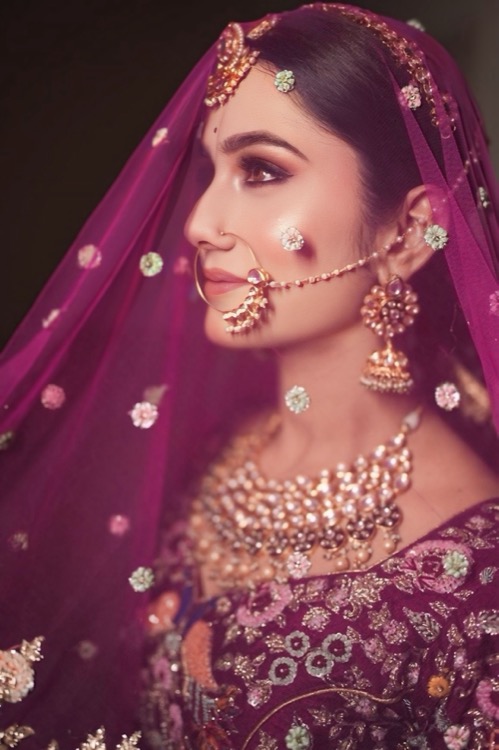 Bridal styling with pink veil and gold jewellery
