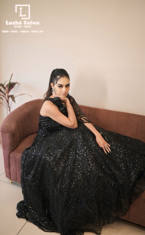Bridal portrait with burgundy embroidered lehenga and gold jewellery